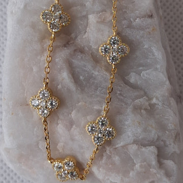 Clover bracelet made of genuine 925 silver, gold plated and studded with zircons