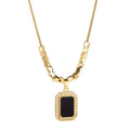 Amber black pendant necklace on model