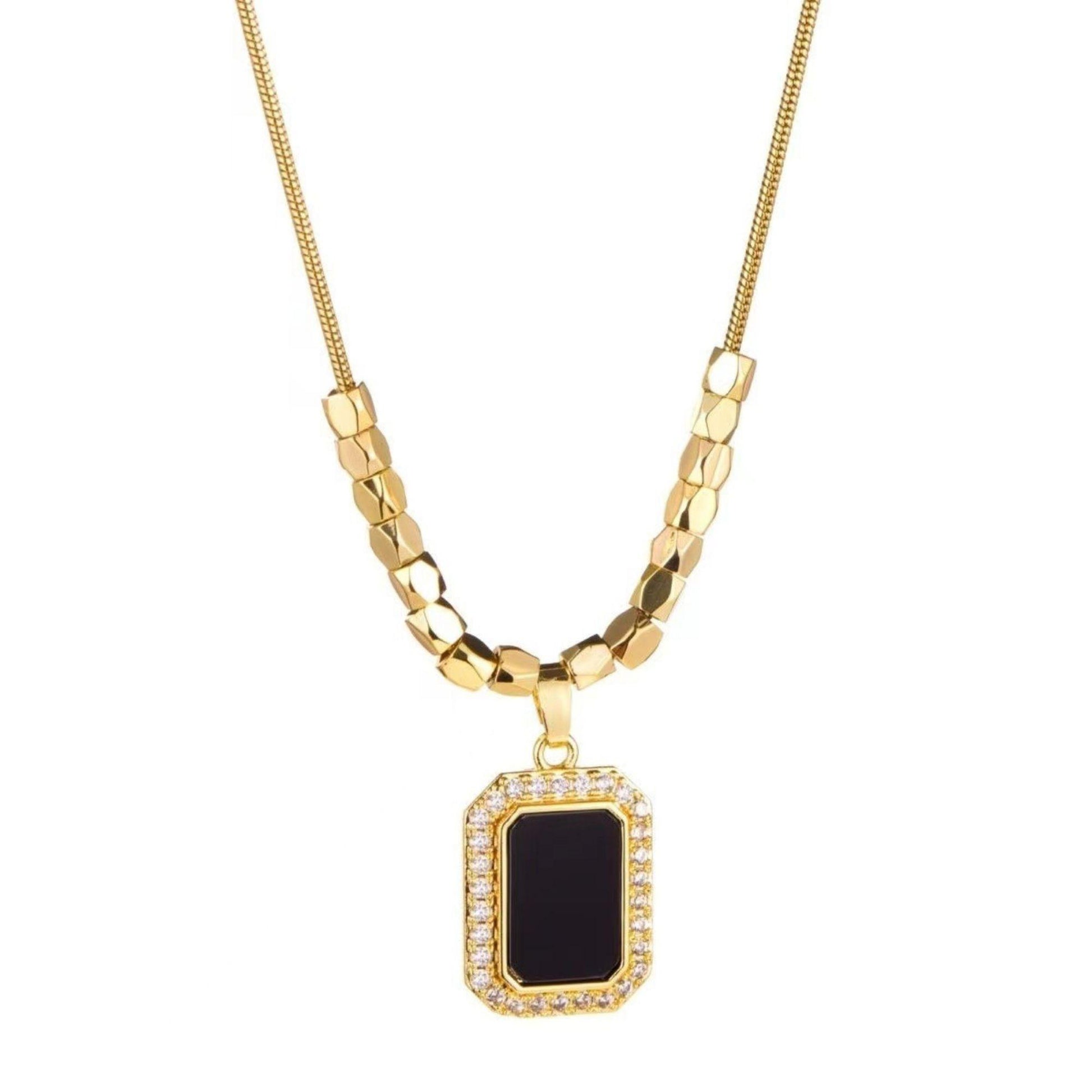 Amber black pendant necklace on model