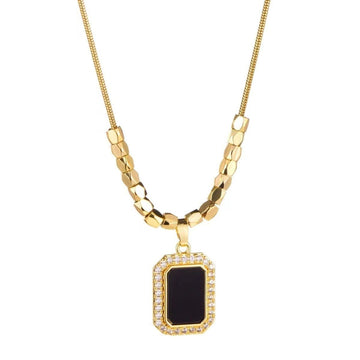Amber black pendant necklace on model