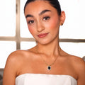 Amber necklace styled with matching black earrings