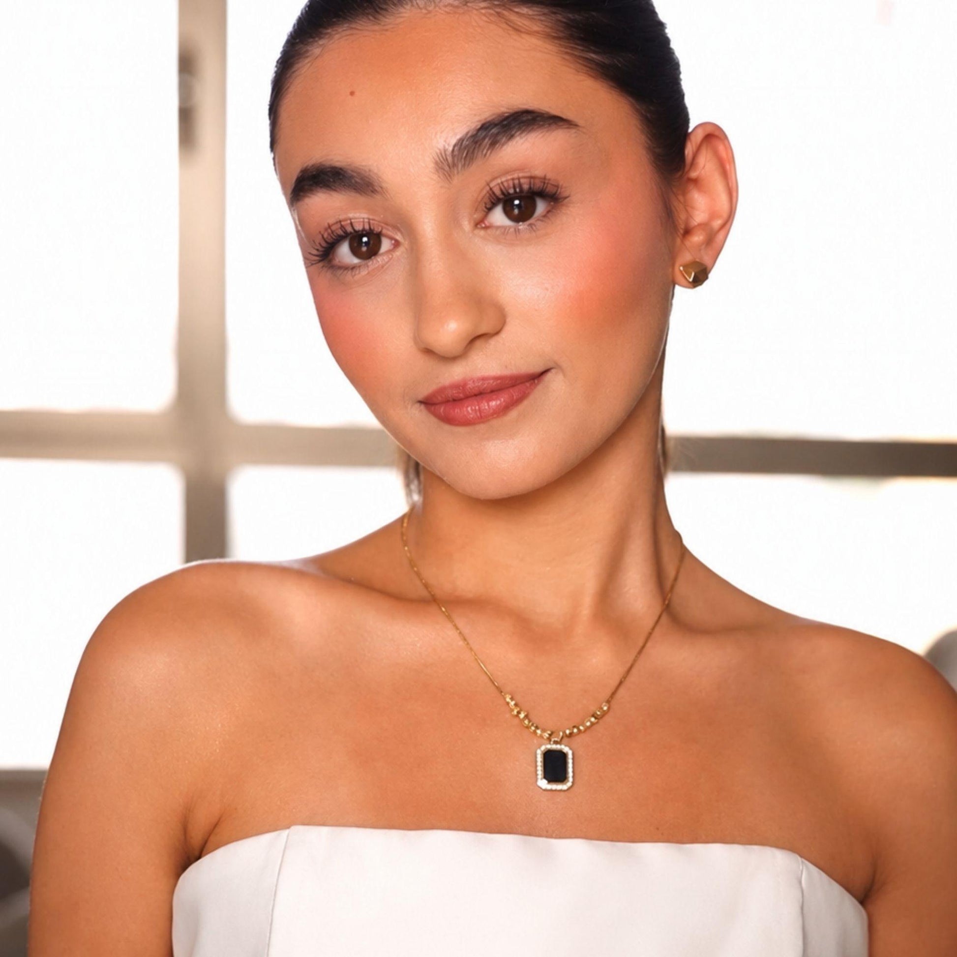 Amber necklace styled with matching black earrings