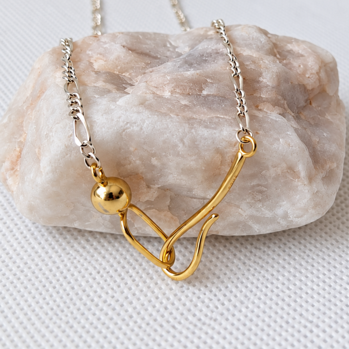 Close-up of Aurelia necklace sculptural gold plated silver front clasp