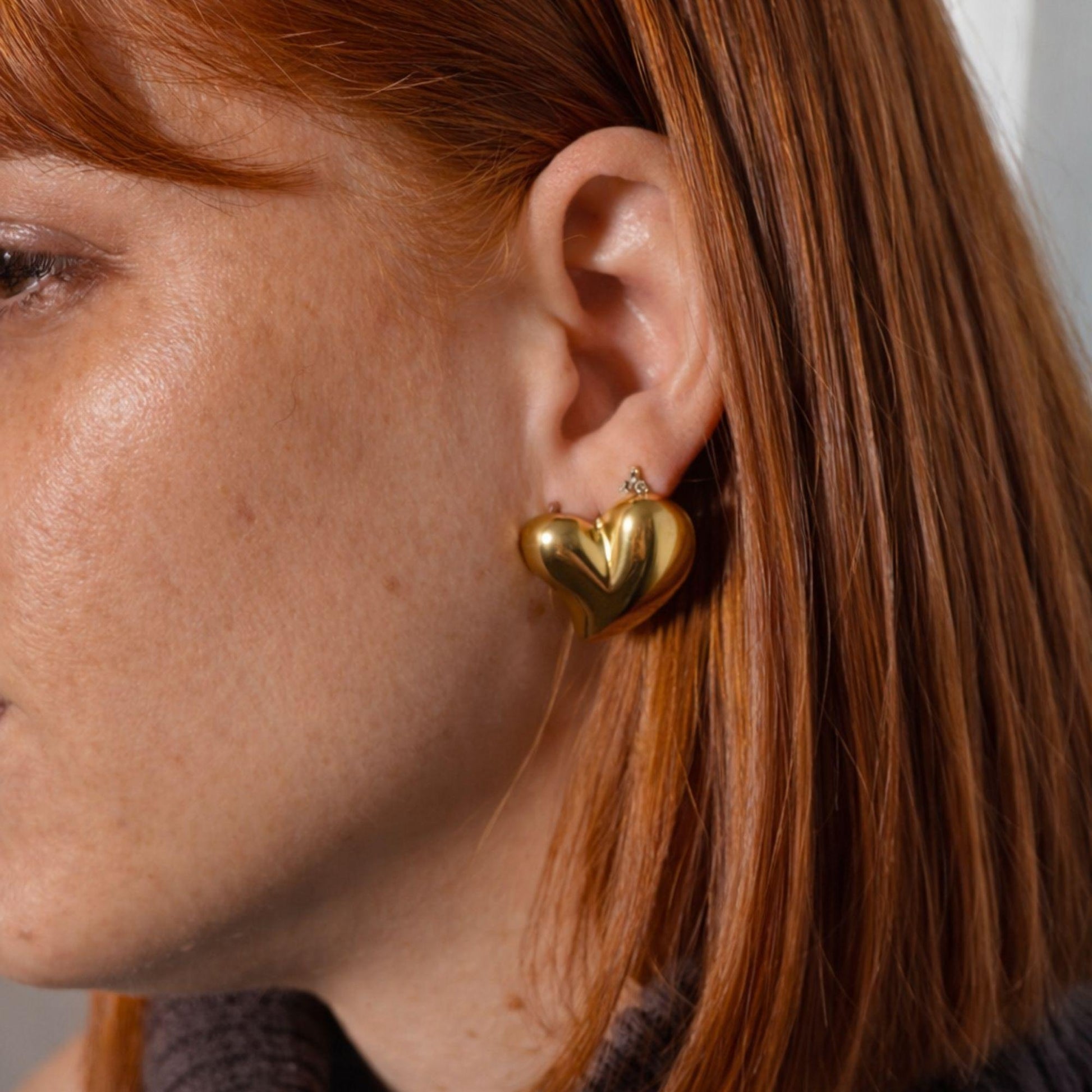 double heart earrings set in gold finish