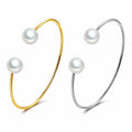 Elara gold pearl cuff bracelet worn on wrist
