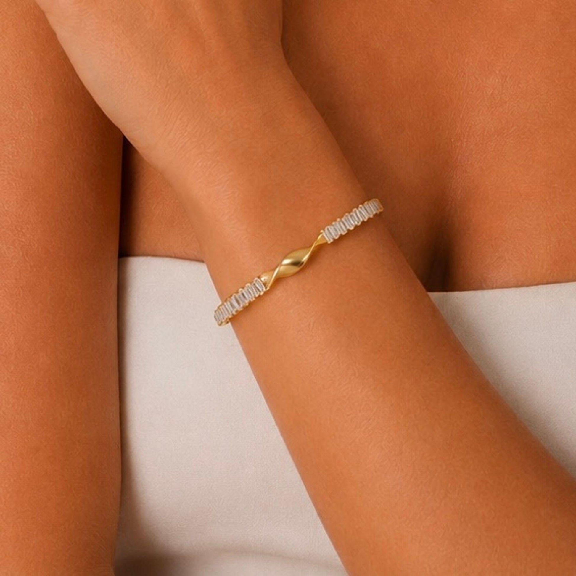 Front detail of Elara gold cuff bracelet with twisted center design and zircon stones
