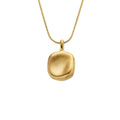 Elara gold stainless steel necklace with organic sculptural pendant