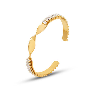 Elara gold stainless steel cuff bracelet with zircon details and sculptural twist design