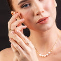 elegant halo moissanite ring on hand