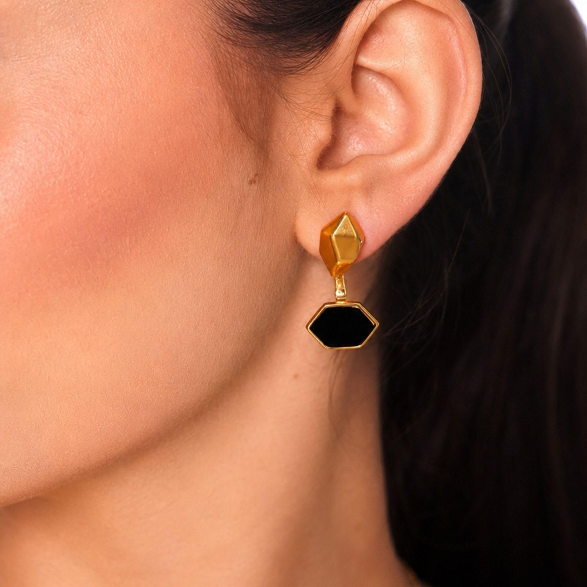 geometric gold earrings with black onyx detail