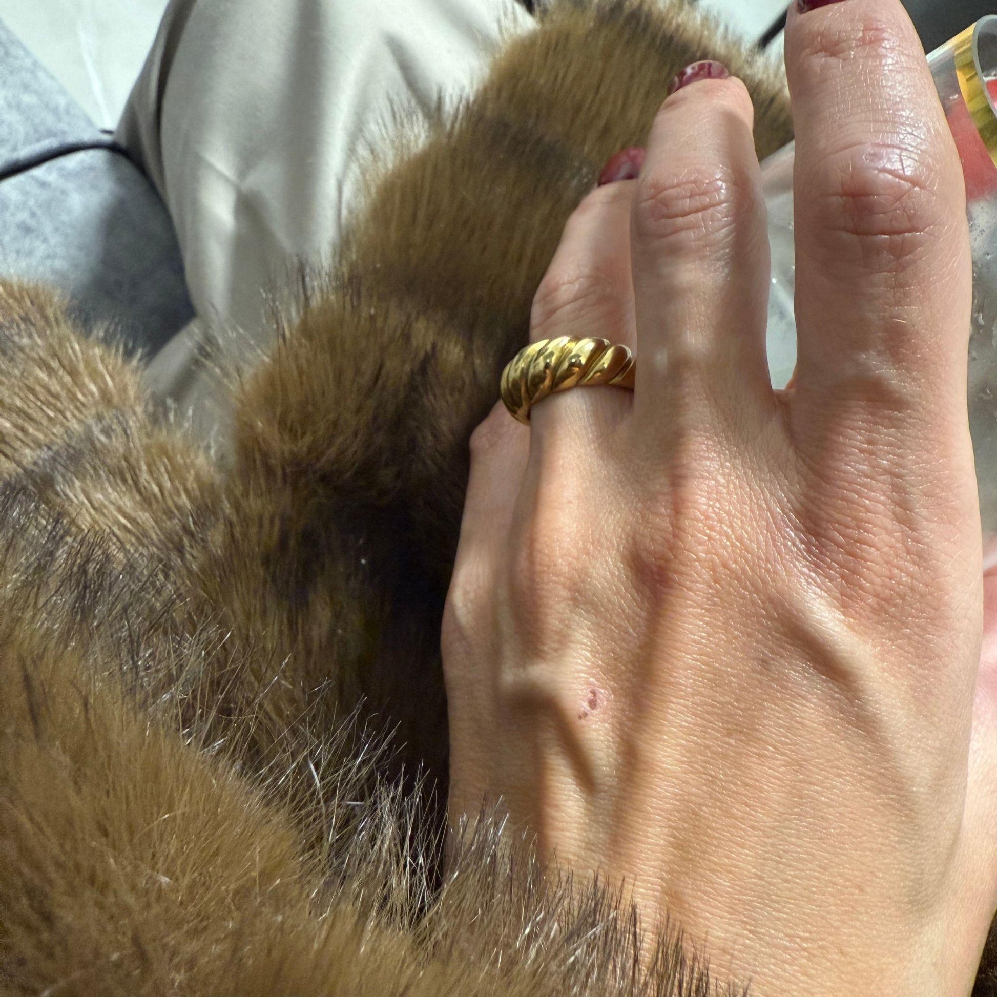 gold band ring textured detail close up