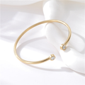 Liora gold zircon cuff bracelet worn on wrist