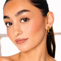 luxury black earrings on model