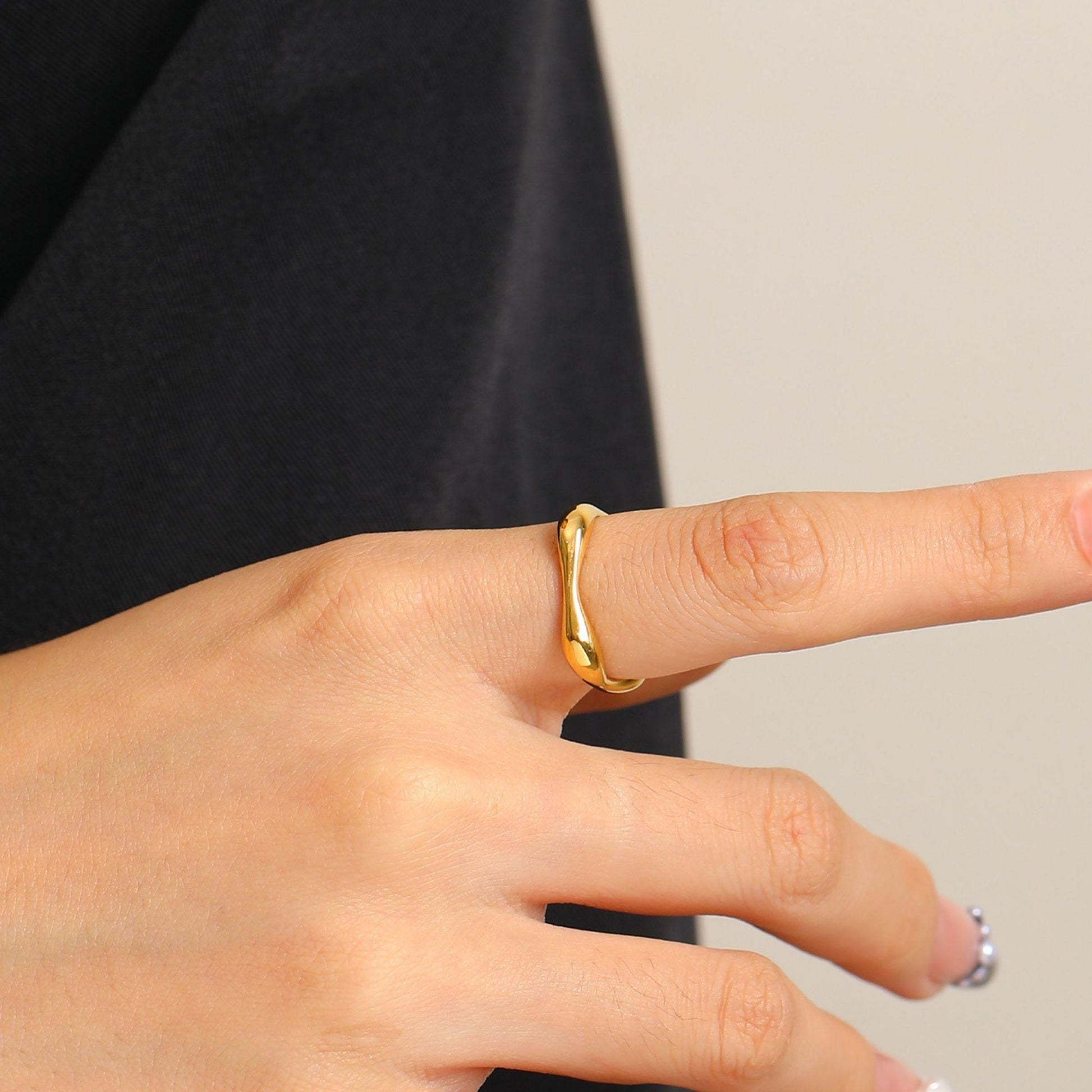 organic gold ring with flowing sculptural design