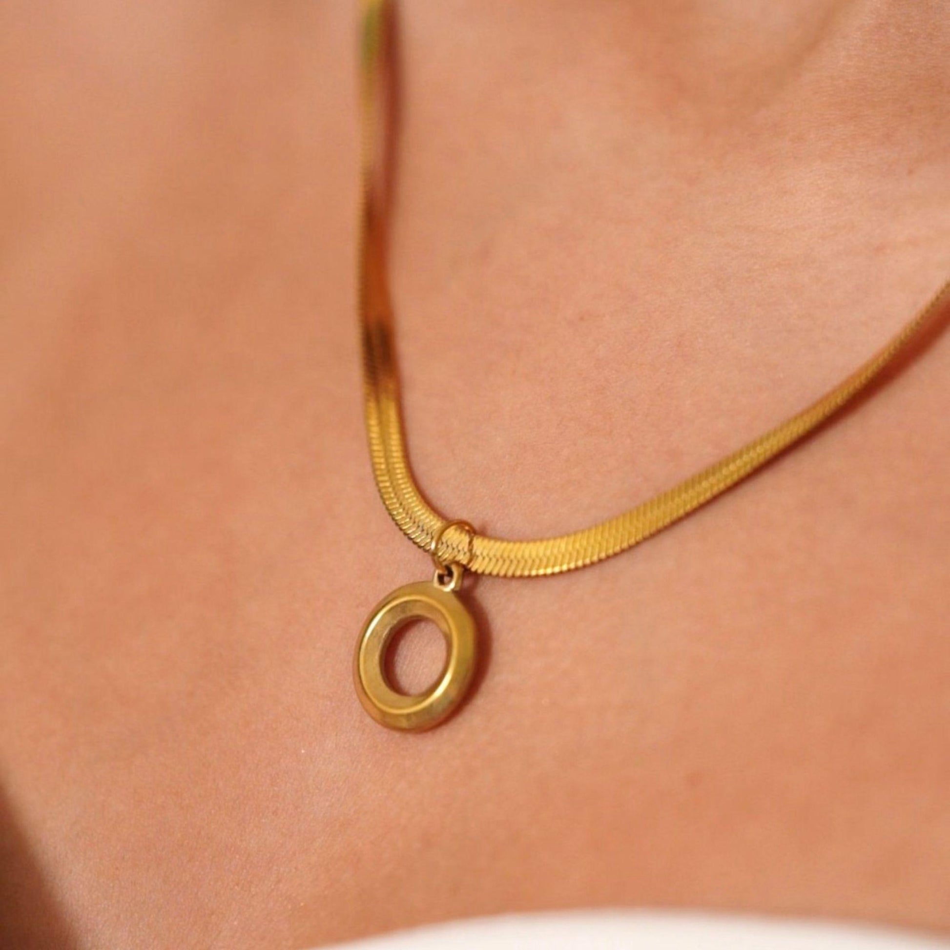 woman wearing oria gold necklace