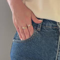 Aurelia Flow silver and gold sculptural ring worn on hand
