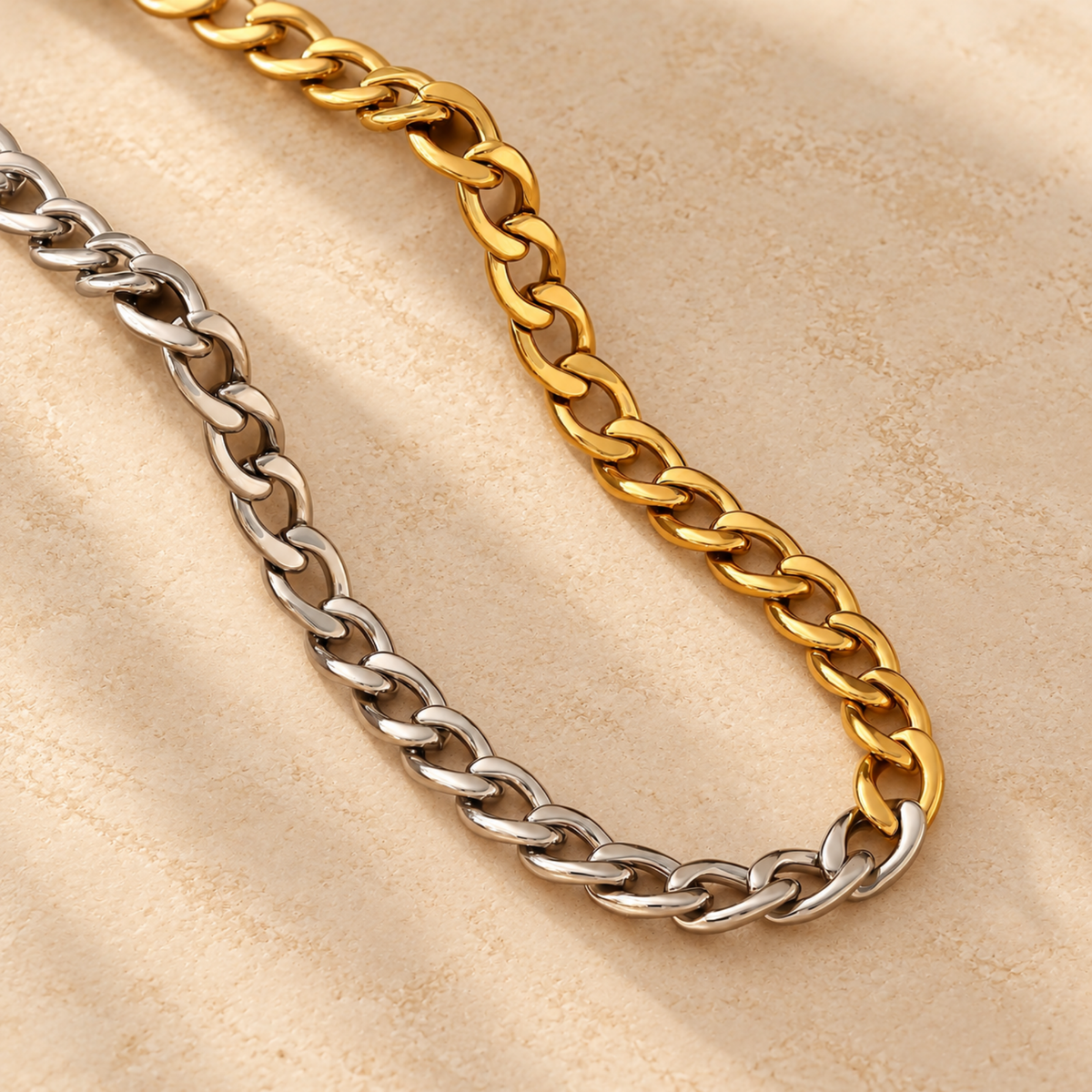 Close-up of Sienna interlocking gold and silver chain links