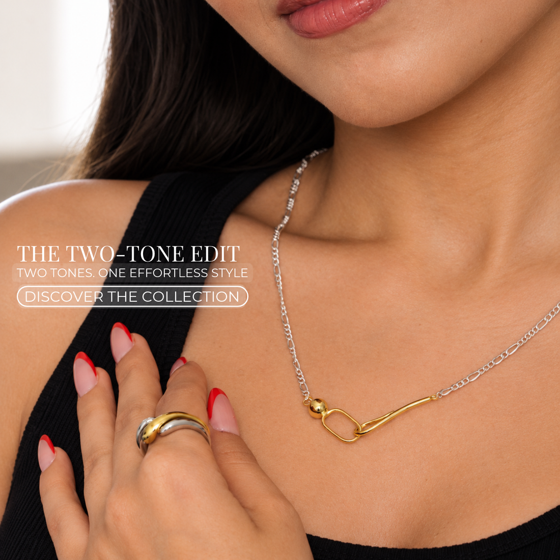 Close-up of a model wearing Yasmine two-tone gold and silver jewellery, including a necklace and statement ring