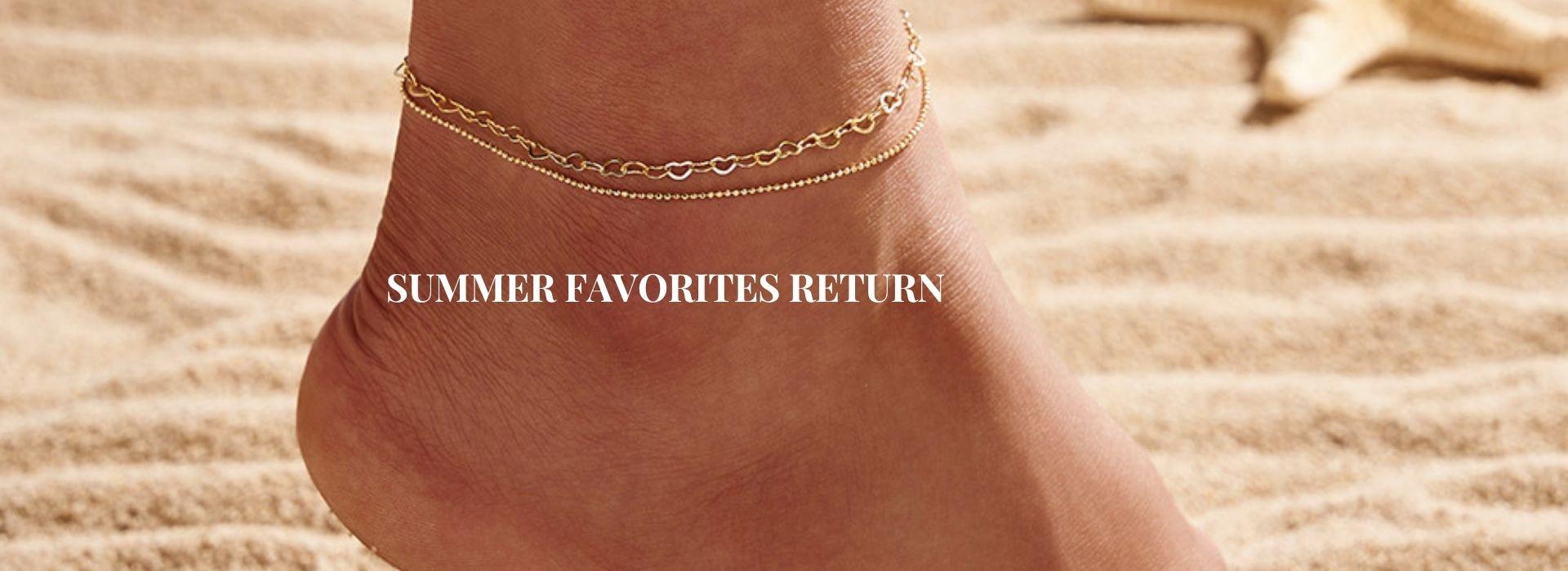 Gold anklet on a woman's ankle at a sunny beach with seashells - YASMINE Waterproof Anklets⁠